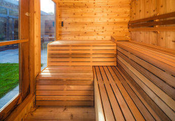 Wooden sauna with natural light at Lodge Essenburgh, Veluwepark de Bosgraaf, Netherlands.