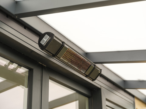 Outdoor heater mounted on the ceiling of Rosendael Comfort lodge at Veluwepark de Bosgraaf in the Netherlands.
