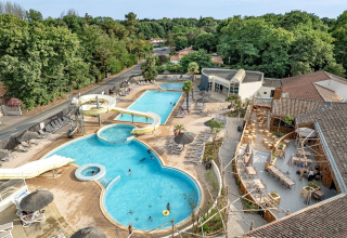 Aerial view of pool area with water slides and loungers at Flower Camping Au Bois Des Biches, Pays de la Loire.