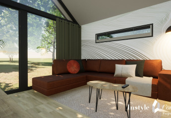 Salon moderne au Cosy Lodge du Camping Si-Es-An, Pays-Bas, avec canapé marron et grandes fenêtres donnant sur la nature.