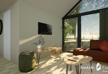 Espace salon lumineux et moderne au Cosy Lodge du Camping Si-Es-An aux Pays-Bas avec vue sur la nature.