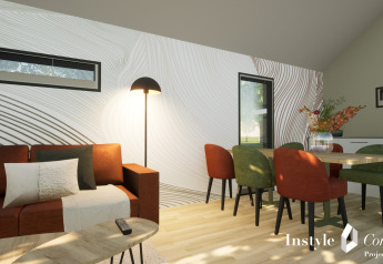 Salon moderne à Cosy Lodge, Camping Si-Es-An, Pays-Bas, avec des chaises colorées et un décor mural original.