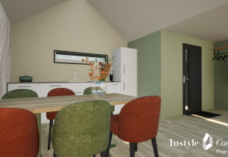 Moderne spise- og opholdsområde i Cosy Lodge på Camping Si-Es-An, Holland, med farverige stole.