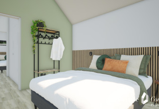 Moderne soveværelse med grønne vægge, dobbeltseng, pyntepuder og åbent garderobestativ i Cosy Lodge.