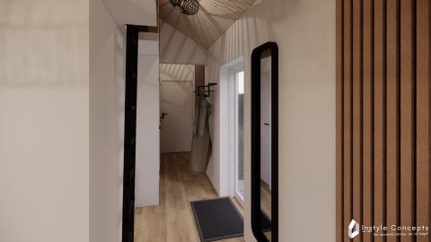 Indgangsparti i Reestdal lodge på Camping Si-Es-An, Nederlandene, med moderne træinteriør og spejl.