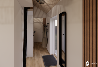 Hallway inside Reestdal lodge at Camping Si-Es-An in the Netherlands featuring wood accents and mirror.