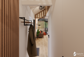 Indgang med trægulv og opholdsstue i Reestdal lodge på Camping Si-Es-An i Nederlandene.