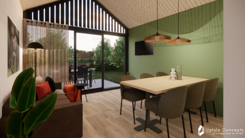 Moderne stue og spisestue med grønt vægdesign i Reestdal lodge på Camping Si-Es-An, Holland.