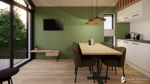 Moderne spisestue og køkken i en lodge på Camping Si-Es-An, Reestdal, Nederlandene med grøn væg.