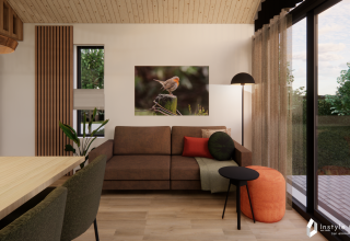 Moderne stue i Reestdal lodge ved Camping Si-Es-An, Holland, med brun sofa og naturudsigt.