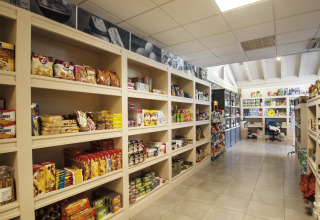 A grocery store with stocked shelves at Weekend Glamping Resort, Lombardy, Italy.