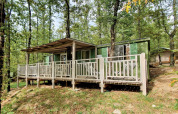 Grünes Cottage mit Veranda mitten im Wald im Chianti Glamping Resort Italien, Cottage Classic.