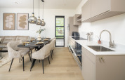 Cucina e zona pranzo di un lodge moderno con arredamento elegante, toni neutri e illuminazione di design.