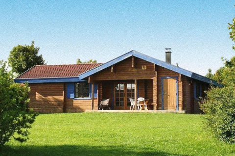 Wooden chalet in Holiday Park Lauterdörfle, Type D Neckar, for 6 people, 70 sqm, on lush green lawn.