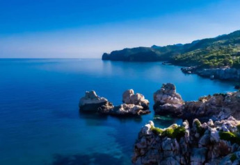 Stunning coastal view near rocks and clear blue sea at Camping del Mar BUNGALOW MEDITERRANI in Spain.