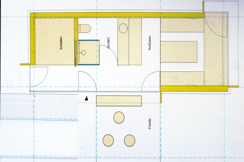 Floor plan of Haus Wasser cabin in Germany, showing bedroom, shower, kitchen/dining, and terrace.