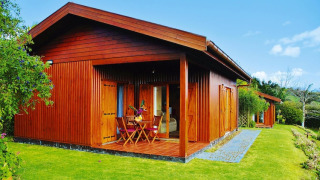 Wooden bungalow at Holiday homes Quinta dos Curubás Vila Franca do Campo featuring terrace and garden chairs