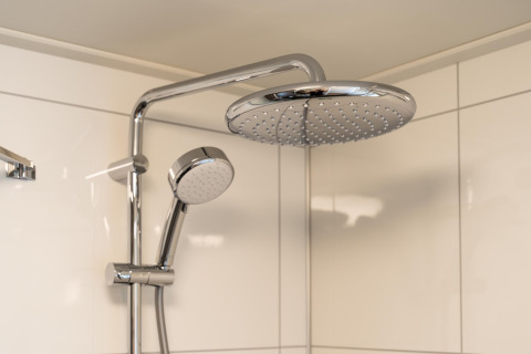 Close-up of a modern shower with rain showerhead and handheld shower at 't Landgoed Baars 1, Netherlands.