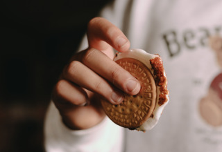 A person holds a filled cookie sandwich at Feather Down De Oude Melkstal holiday park in North Brabant.