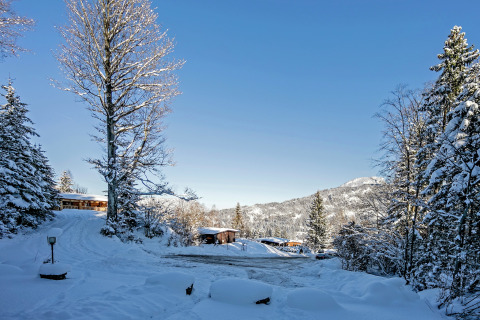 Chalet Catharina im Brixental in Austria, snowy landscape, chalet houses and mountains in winter sun