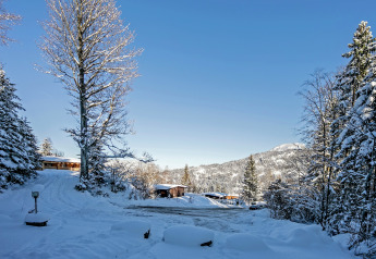 Chalet Catharina im Brixental in Austria, snowy landscape, chalet houses and mountains in winter sun
