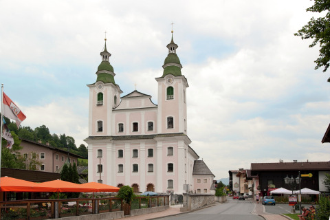 View of a picturesque church and village street near Chalet Catharina im Brixental, Austria.