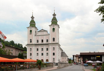 View of a picturesque church and village street near Chalet Catharina im Brixental, Austria.