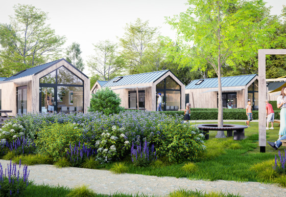 Modernas cabañas de madera y jardines floridos en Dordogne Deluxe, personas disfrutando del entorno natural.