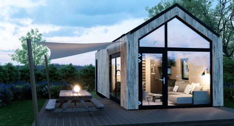 Moderna cabaña Dordogne Deluxe en La Draille, Francia, con grandes ventanales, terraza y zona de picnic.