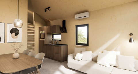 Interior moderno de una cabaña con cocina, mesa, sofá y escalera en Dordogne Deluxe en La Draille, Francia.