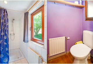 Badkamer in de Manonfa lodge in België met douche, toilet, raam, radiator en paarse muren.