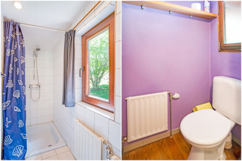 Bagno nella lodge Manonfa in Belgio con doccia, WC, finestra, termosifone e pareti viola.