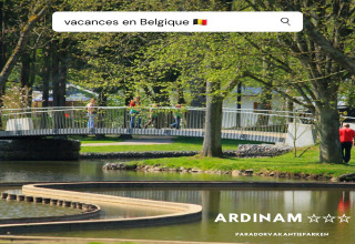 Photo of Holiday Park Ardinam 1 in Belgium, showing a scenic bridge, trees, pond, and people enjoying a walk.
