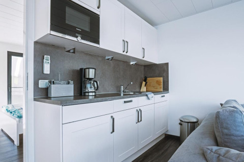 Modern kitchenette on houseboat Floating 33 - LP 16 in Germany with coffee maker, microwave and sink