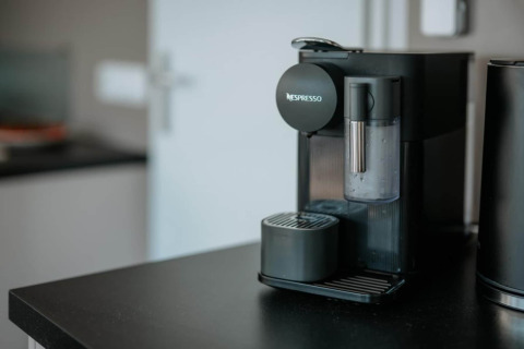 A Nespresso coffee machine is placed on the kitchen counter inside a houseboat in Zehdenick, Germany.