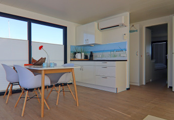 Modern dining area and kitchen aboard Houseboat Family & Friends LP 4, bright and cozy interior in Germany.