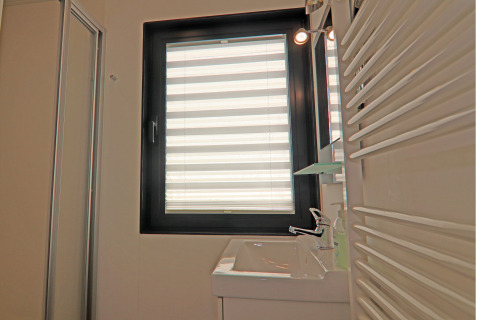Bathroom on houseboat Family & Friends LP 4 in Germany with window, sink, faucet, and radiator