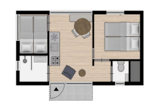 Plantegning af sommerhus ved stranden med to soveværelser, lille stue og et badeværelse.