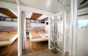 Interior photo of Cottage Clever lodge at Vacanze Glamping Boutique in Italy, featuring bright bedroom and bath.