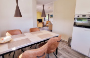 Bright modern dining area in mobile home Chalet Limonet at Camping & Ferienpark Brilon, Germany.