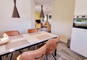 Bright modern dining area in mobile home Chalet Limonet at Camping & Ferienpark Brilon, Germany.
