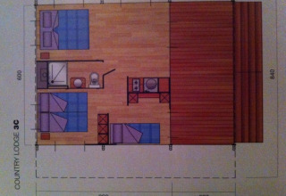 Floor plan of a safari tent with sanitary facilities at Camping Podere sei Poorte, Italy, viewed from above.