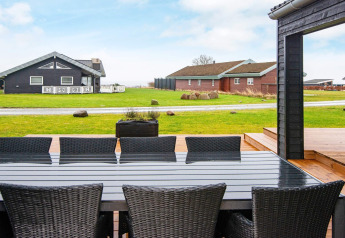 Uitzicht vanaf het terras van het 8-persoons vakantiehuis in Sydals, Denemarken met tuinmeubilair.