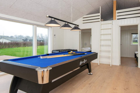 Game room in holiday home in Sydals, Denmark, featuring blue pool table, large windows and lofts.