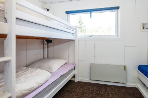 Room with bunk beds and a window at a 6 person holiday home in Glesborg, Denmark. Bright and cozy.