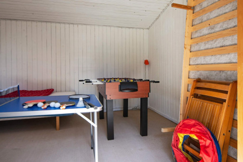 Game room at a holiday home in Glesborg, Denmark, with foosball, table tennis, and other activities.
