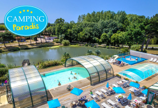 Aerial view of Camping Paradis La Bretonnière, Pays de la Loire, France, with covered pools and sun loungers.