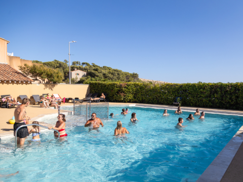 Swimming pool at Campsite Les Tamaris in Provence-Alpes-Côte d’Azur, France, with guests enjoying the water.