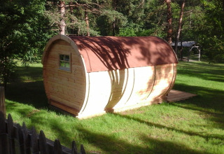Photo of the 'Barrel' pod at Campsite Ushuaïa Villages Le Viaduc in France, surrounded by greenery.