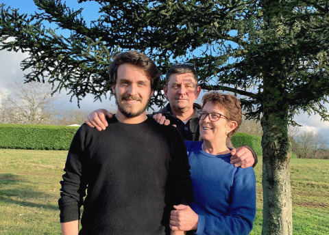 Three people smiling in front of a tree at Campsite La Nouvelle Croze, a holiday park in Nouvelle-Aquitaine, France.